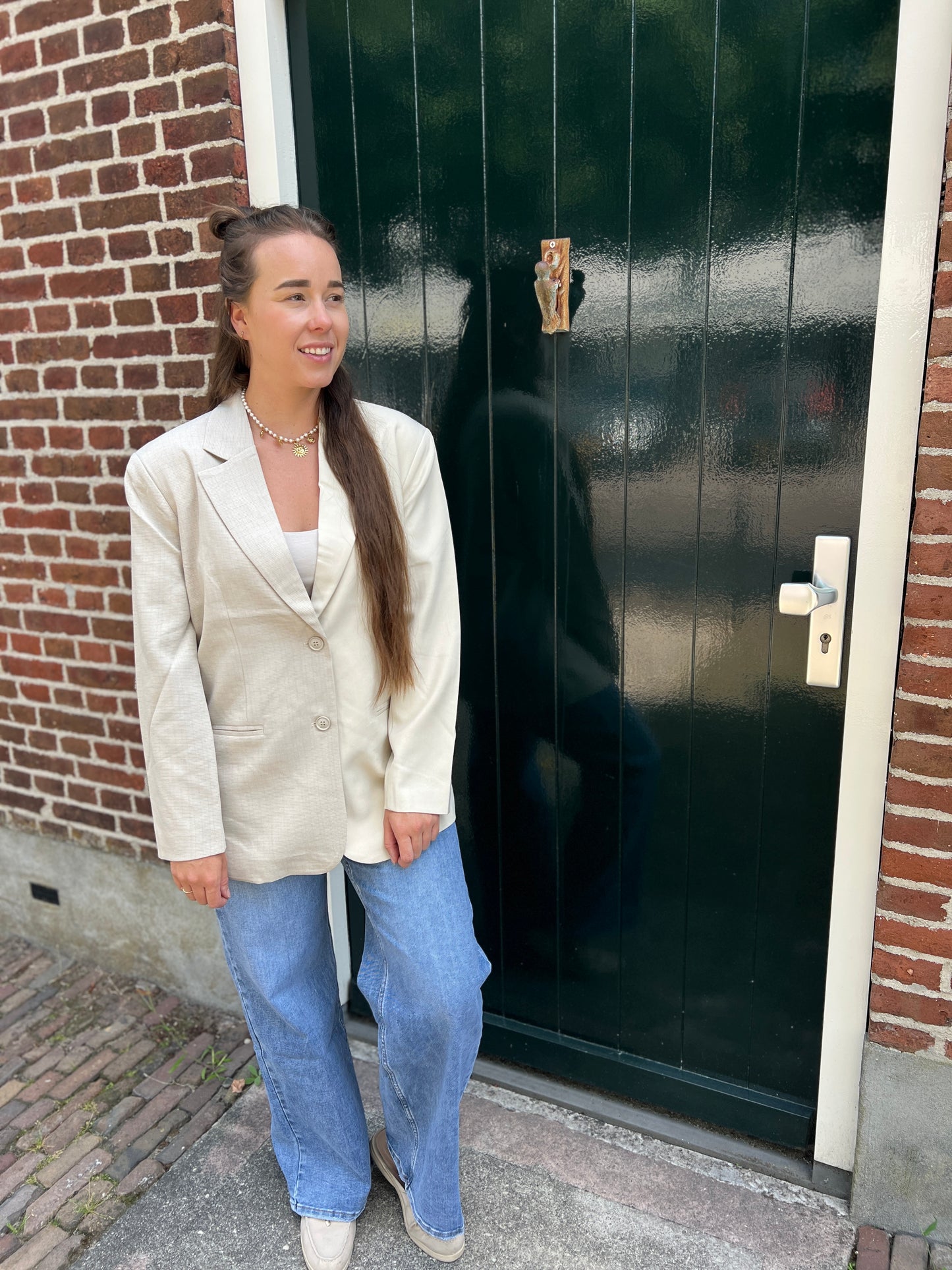 Jeans met schuine knoop
