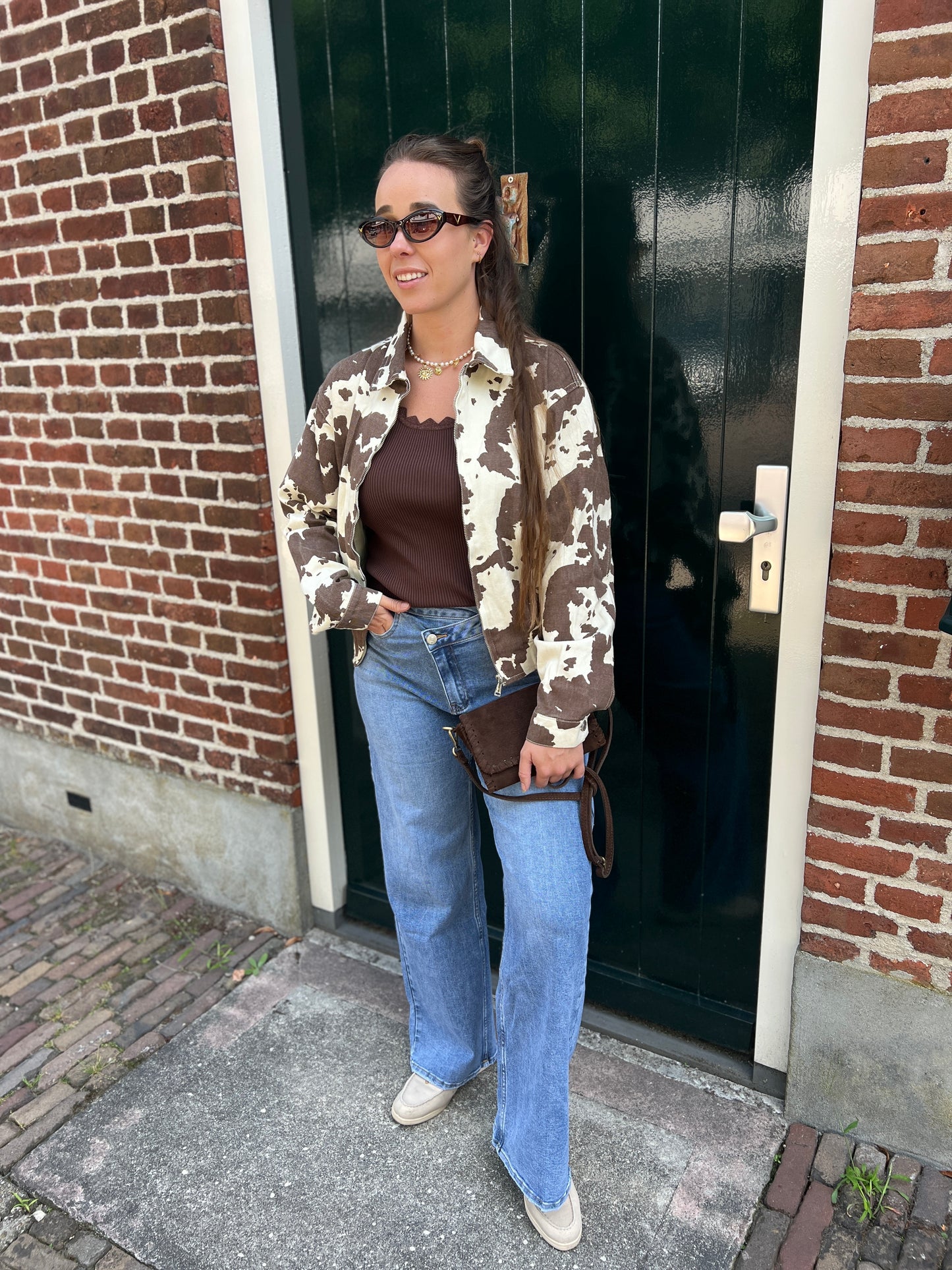 Jeans met schuine knoop